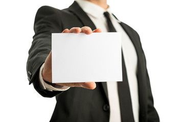 Business man holding blank card with copyspace ready for your te