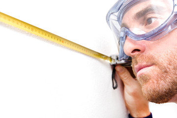 Man measuring a wall