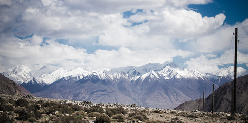 Mountains and clouds on Pamir. Spring. Tajikistan. Toned