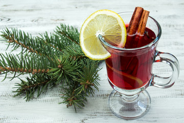 Mulled wine on a white wooden background