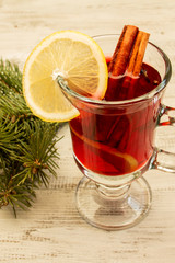 Mulled wine on a white wooden background