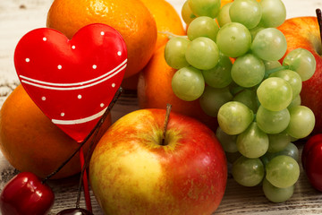 Juicy fruit on a white wooden background