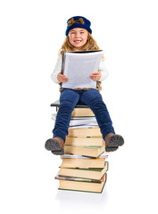 Student little girl sitting on books