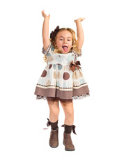 Little blonde girl jumping over white background