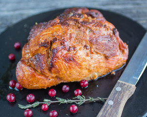 baked meat with cranberries and thyme