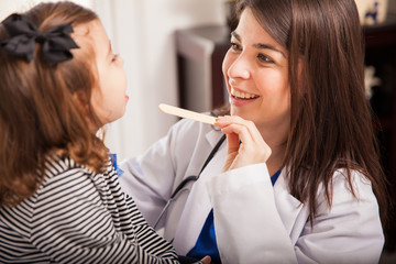 Beautiful pediatrician at work