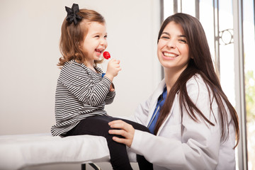 Happy girl with her pediatrician