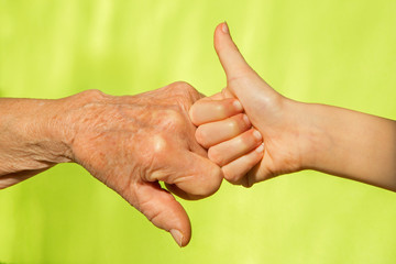 hand of senior and child