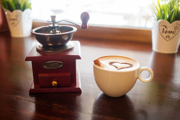 Coffee cup with milk and heart shape