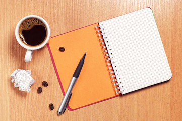 Coffee cup and notepad