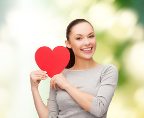 smiling asian woman with red heart