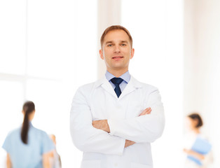 Fototapeta premium smiling male doctor in white coat