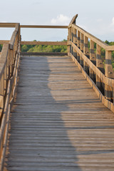 wooden panoramic bridge over the sand dunes of Tuscany