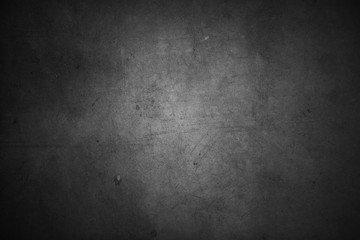 Grey concrete wall texture background. Dark edges