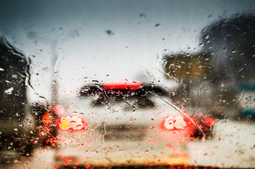 Car lights through the wet windshield