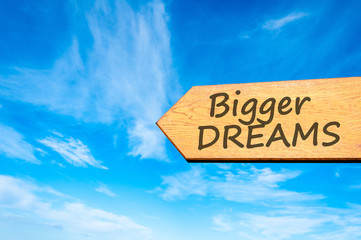 Arrow sign with Bigger Dreams message