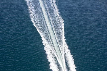 Tuinposter Speed boats trace on the blue sea © smuki