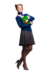 girl standing with a bunch of books