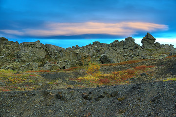 View of lenticular clouds over volcanic landscape near Myvatn