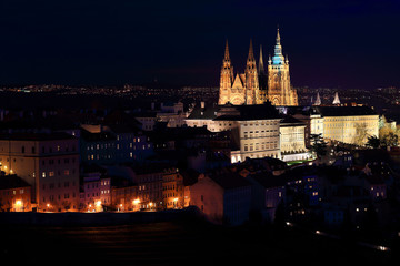 Fototapeta na wymiar Night winter Prague City with St. Nicholas' Cathedral