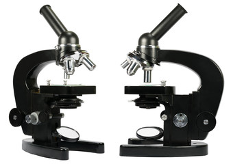 Two microscopes isolated on white