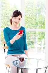 young asian woman relaxing in the cafe