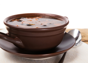 Traditional Russian meat soup and salty cucumbers