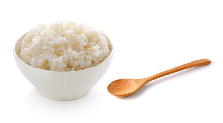 rice in a bowl and wooden spoon on white background