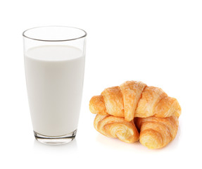 Glass of milk and croissants isolated on white