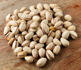 Pistachios on wooden background