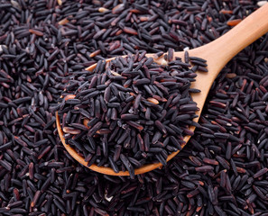 black rice in wooden spoon