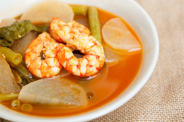 Sour soup with shrimp and vegetable.