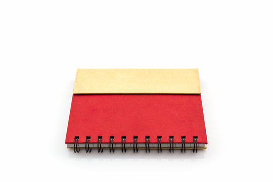 Red diary book on white background.