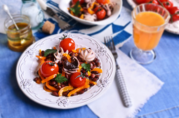 Salad of cooked beans, vegetables and octopus