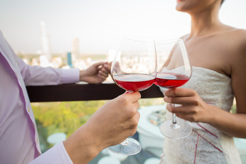 Clinking wine-glasses