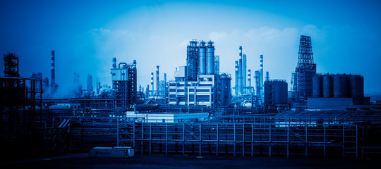 refinery with smoke stacks
