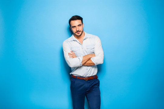 Handsome Adult And Masculine Man On A Blue Background