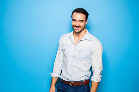 Handsome Adult And Masculine Man On A Blue Background