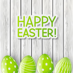 Easter greeting card with green eggs