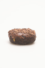 Fresh baked single donut on a white background.