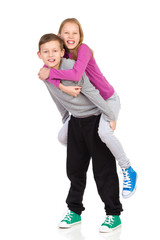 Brother and sister piggyback