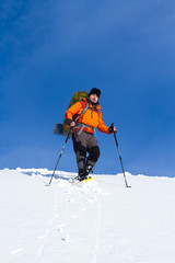 Fototapeta na wymiar Hiker in winter mountains