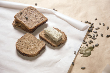 Different kinds of bred with tofu cheese and pumpkin seeds