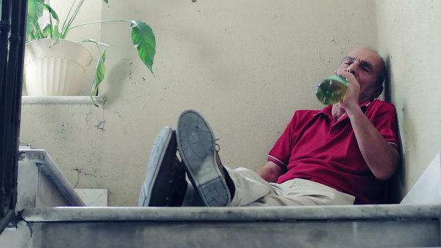 Old man gets drunk after losing his job