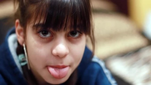 beautiful child  sticking out her tongue