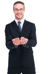Smiling businessman holding out his hands