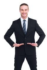 Happy businessman standing with hands out