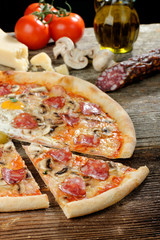 Delicious italian pizza with Salami and egg