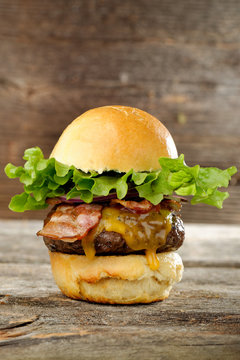 Gourmet bacon cheeseburger with lettuce and tomato