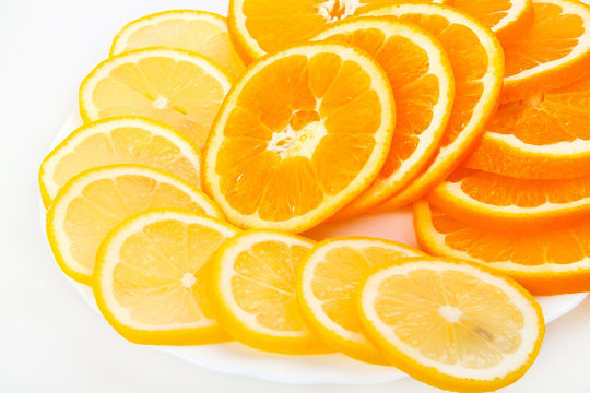 Composition of a pile of juicy orange and lemon slices
